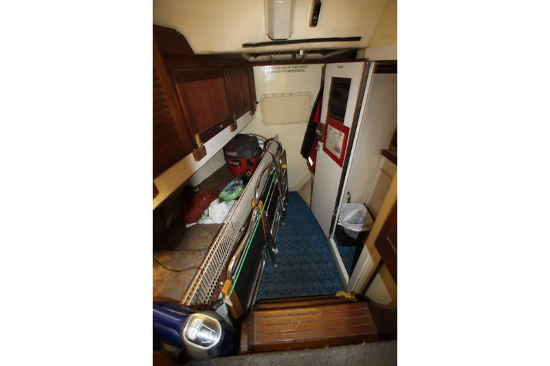 Slide: The Image of Interior of 1980 Delta Boatworks 34 Offshore, featuring storage and equipment. - 28