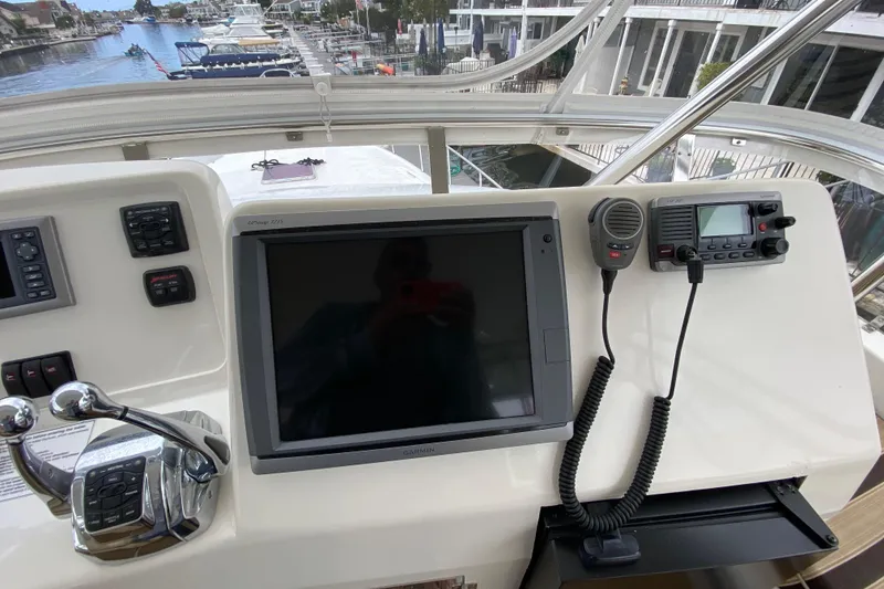 Slide: The Image of Control panel of a 2012 Mikelson 43 Sportfisher with navigation and communication equipment. - 20
