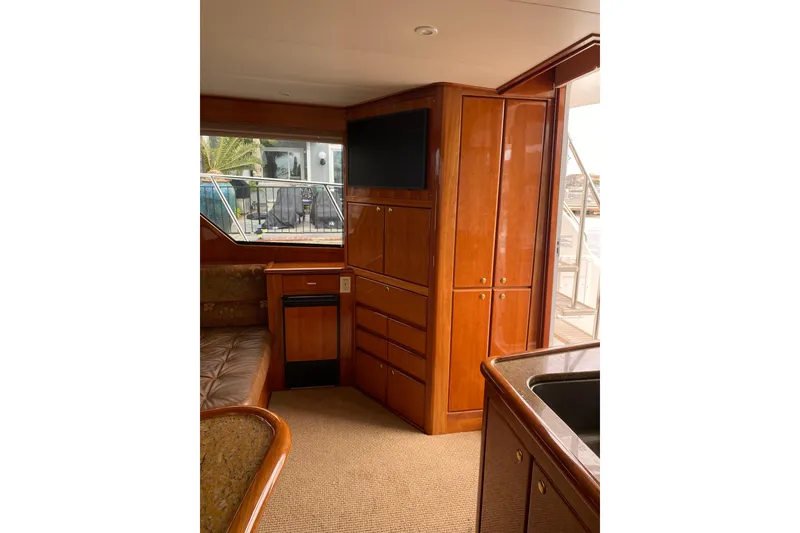 Slide: The Image of Interior of 2012 Mikelson 43 Sportfisher yacht with wood cabinetry and modern amenities. - 27
