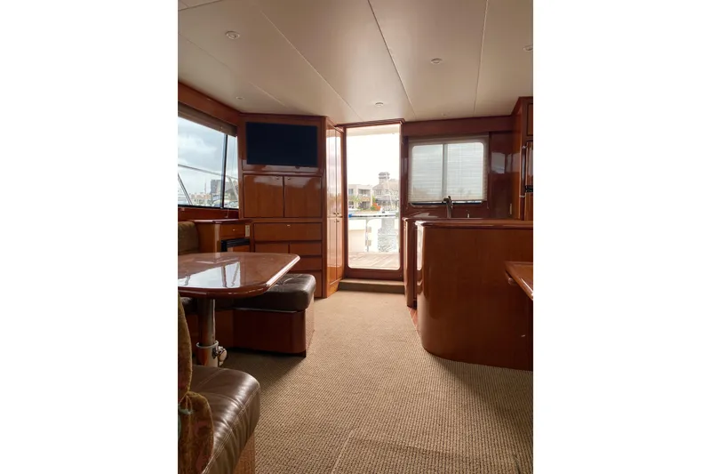 Slide: The Image of Interior of 2012 Mikelson 43 Sportfisher yacht with wood finish and seating area. - 29