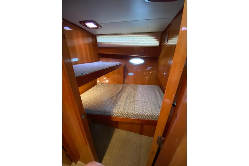 Slide: The Image of Cozy cabin with bunk beds in 2012 Mikelson 43 Sportfisher yacht. - 38