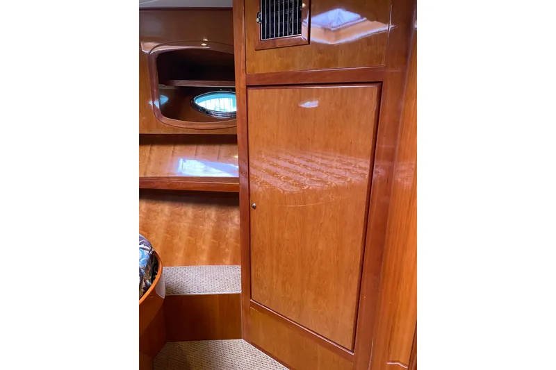 Slide: The Image of Interior of 2012 Mikelson 43 Sportfisher with polished wood finish and porthole. - 42