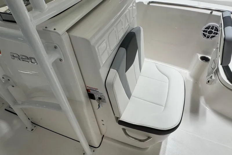 Slide: The Image of 2026 Robalo R200 Center Console boat interior with cushioned seating and sleek design. - 10