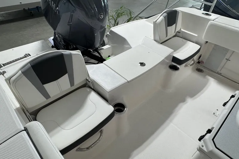 Slide: The Image of 2026 Robalo R200 Center Console boat interior with seating and Yamaha engine. - 4