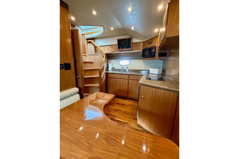Slide: The Image of Luxurious 2009 Navigator California 50 Veneti yacht interior with wood finish and modern amenities. - 10