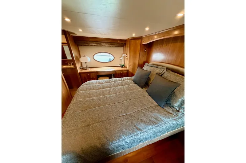 Slide: The Image of Luxurious bedroom interior of 2009 Navigator California 50 Veneti yacht with elegant wood finish. - 11