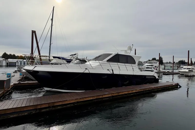 Slide: The Image of 2009 Navigator California 50 Veneti yacht docked at marina under cloudy sky. - 13