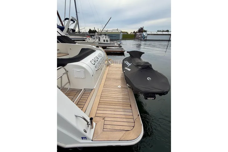 Slide: The Image of 2009 Navigator California 50 Veneti yacht with jet ski on dock. - 17