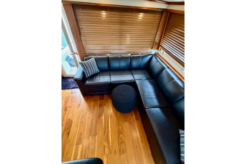 Slide: The Image of Luxurious black leather sectional in 2009 Navigator California 50 Veneti yacht interior. - 23