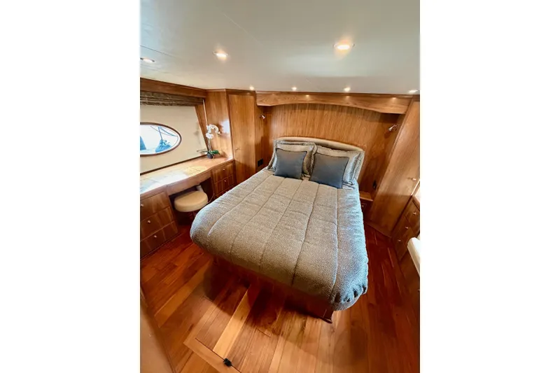 Slide: The Image of Luxurious bedroom interior of 2009 Navigator California 50 Veneti yacht with wooden furnishings. - 25