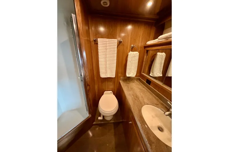Slide: The Image of Luxurious bathroom in 2009 Navigator California 50 Veneti yacht with wood paneling and modern fixtures. - 28