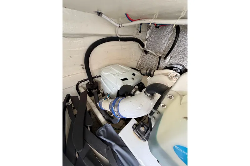 Slide: The Image of Engine compartment of 2009 Navigator California 50 Veneti yacht, featuring hoses and mechanical components. - 32