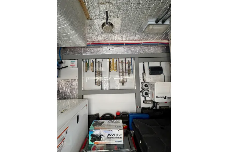 Slide: The Image of Engine room of 2009 Navigator California 50 Veneti yacht with equipment and wiring. - 36