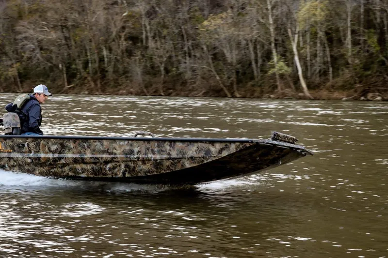 The Image of Man driving 2026 Excel 160 Eclipse Viper boat on a river. - 1