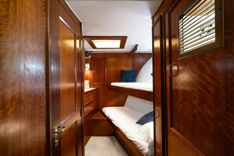 Slide: The Image of 1978 Hatteras 53 Yacht Fisherman cabin with wooden interior and bunk beds. - 40