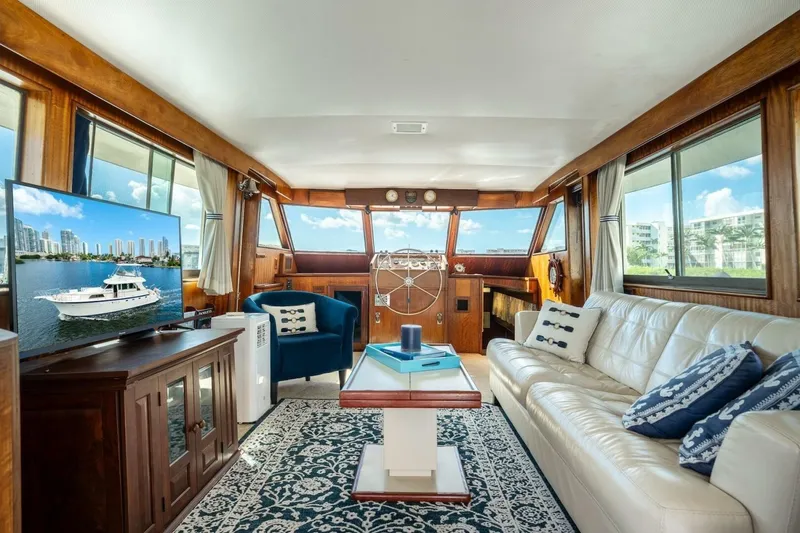 Slide: The Image of Interior of a 1978 Hatteras 53 Yacht Fisherman with elegant seating and nautical decor. - 50
