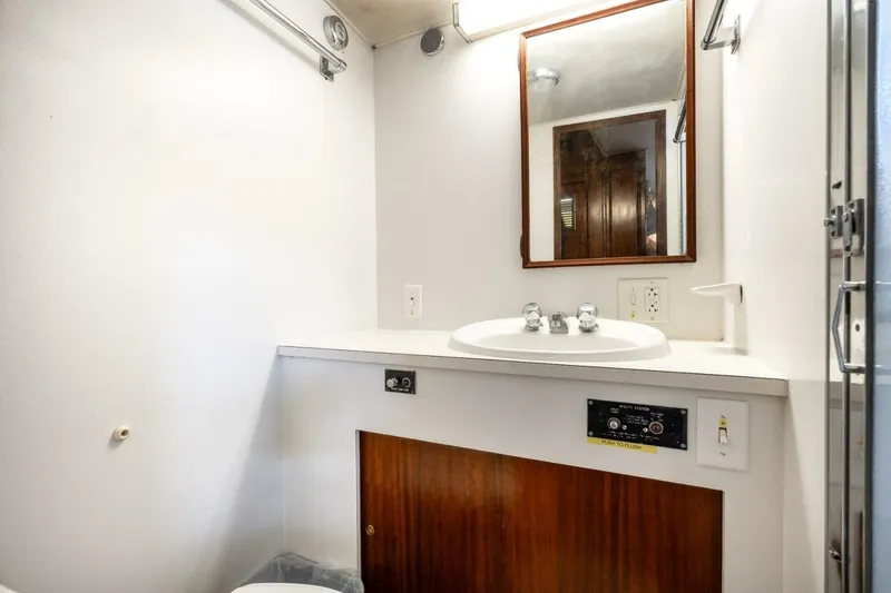 Slide: The Image of Bathroom interior of 1978 Hatteras 53 Yacht Fisherman with sink and mirror. - 60