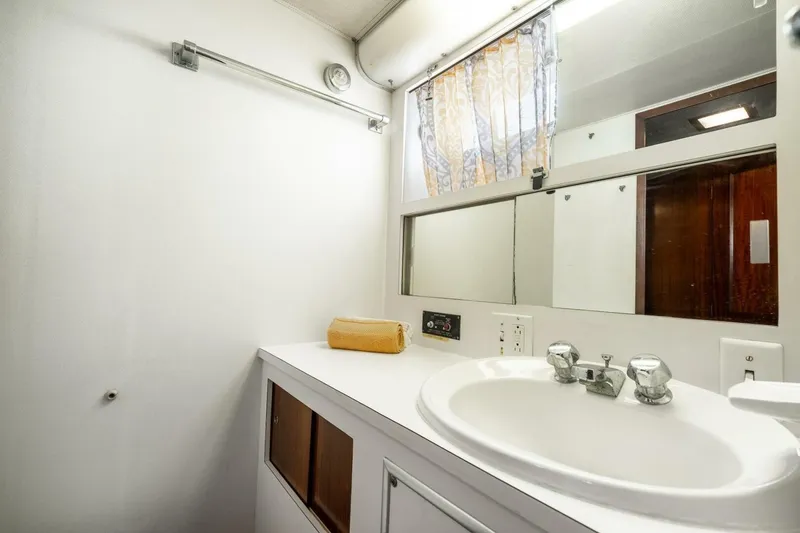 Slide: The Image of Bathroom interior of 1978 Hatteras 53 Yacht Fisherman with sink and mirror. - 71