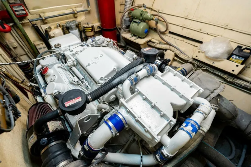 Slide: The Image of Engine room of a 1978 Hatteras 53 Yacht Fisherman, showcasing detailed machinery and components. - 76