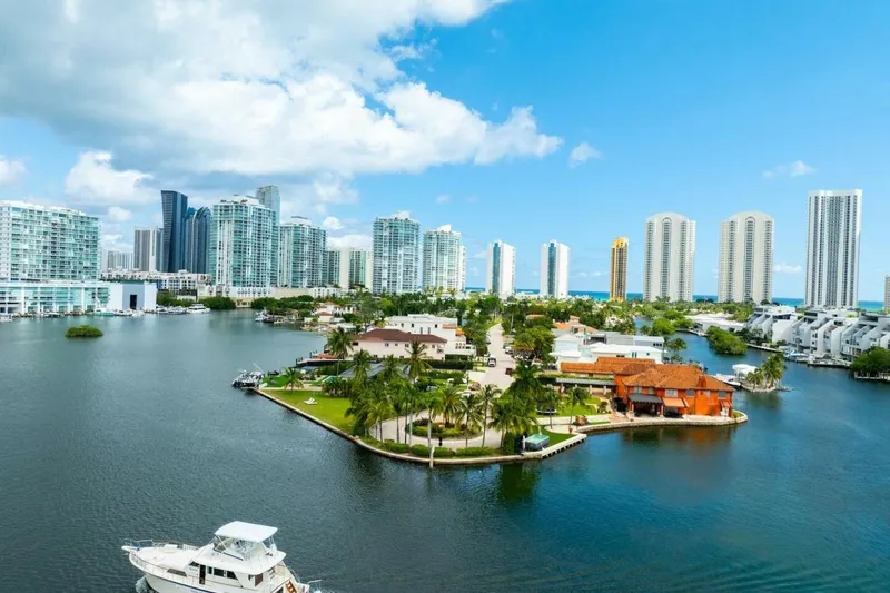 Slide: The Image of Aerial view of 1978 Hatteras 53 Yacht Fisherman near waterfront cityscape. - 8
