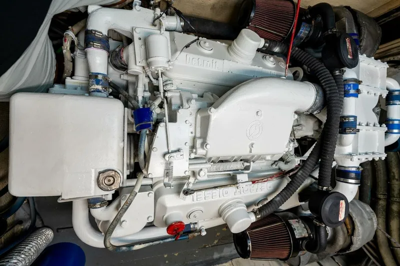 Slide: The Image of Engine of a 1978 Hatteras 53 Yacht Fisherman, showcasing detailed mechanical components. - 85