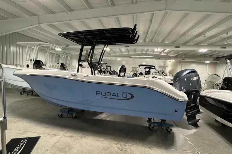The Image of 2026 Robalo R202 Explorer boat in showroom, featuring Yamaha engine. - 1