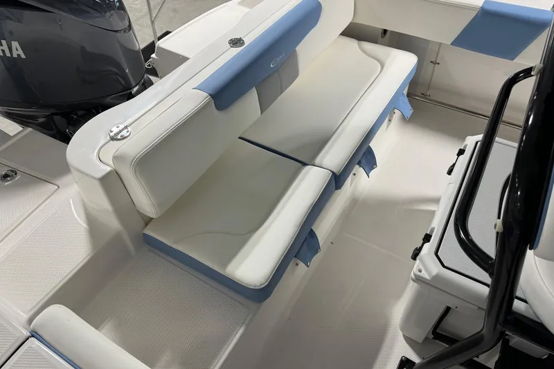 Slide: The Image of 2026 Robalo R202 Explorer boat interior with cushioned seating and Yamaha engine. - 10