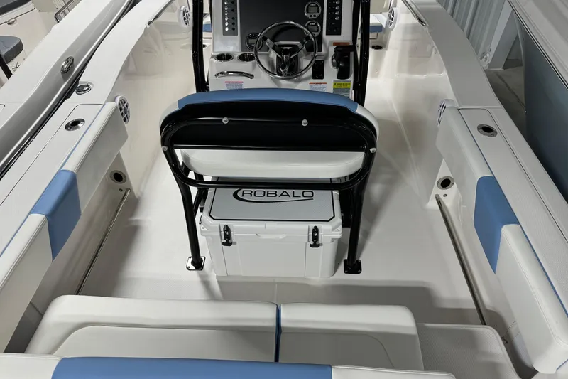 Slide: The Image of 2026 Robalo R202 Explorer boat interior with seating and console. - 12