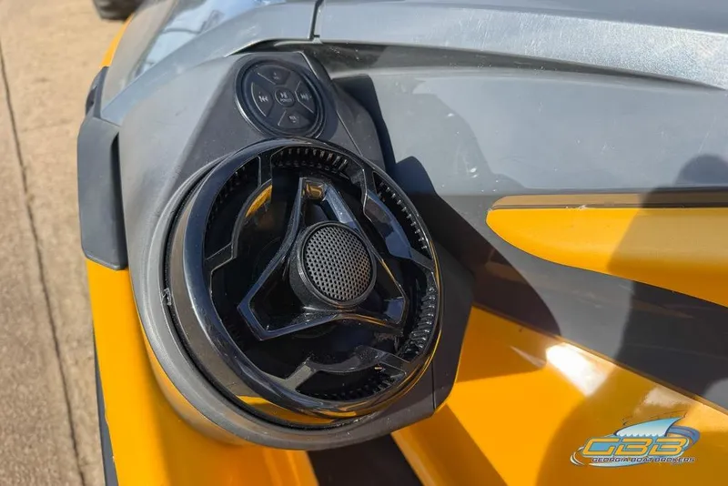 Slide: The Image of Close-up of 2021 Sea-Doo RXT-X 300 speaker and controls on yellow and gray body. - 4