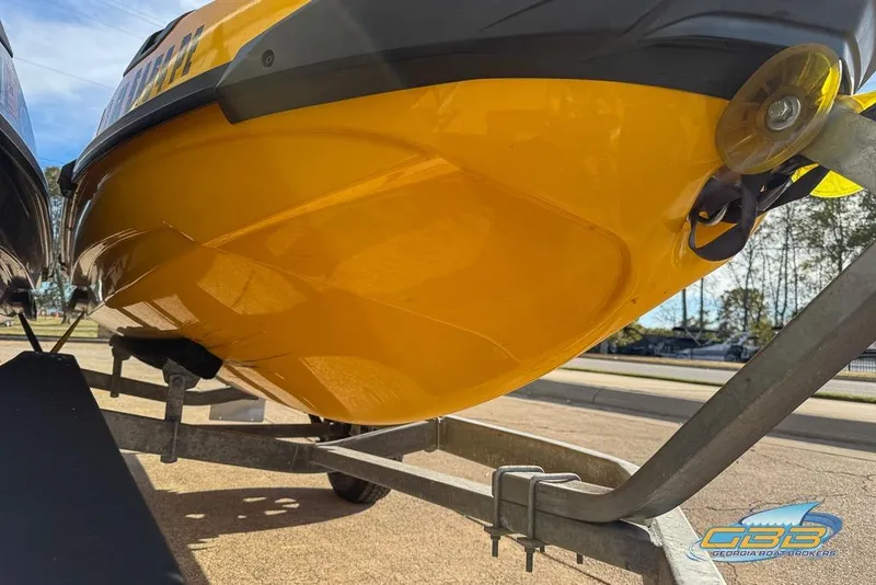 Slide: The Image of 2021 Sea-Doo RXT-X 300 on trailer, yellow hull, outdoor setting. - 5