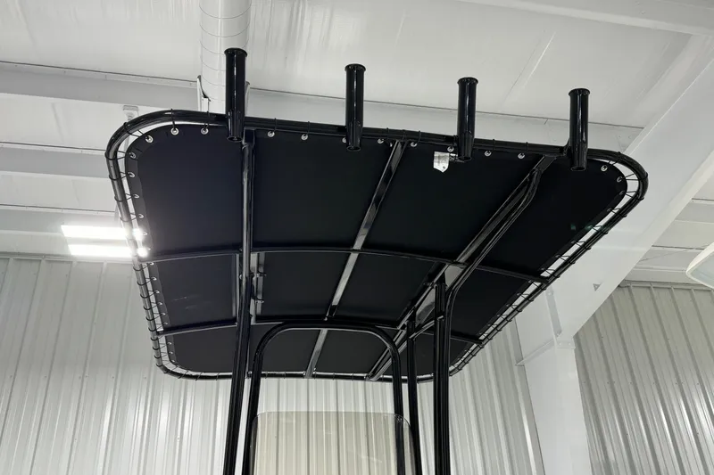 Slide: The Image of 2026 Robalo R202 Explorer T-top structure in a showroom setting. - 14