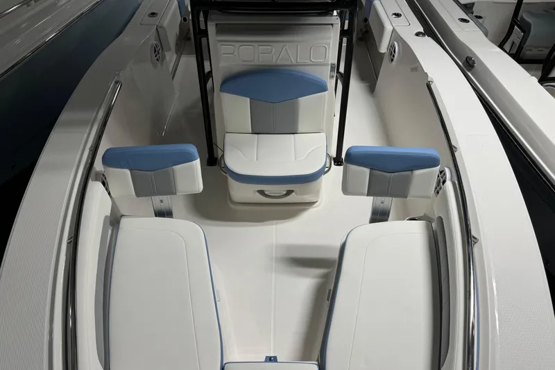 Slide: The Image of 2026 Robalo R202 Explorer boat interior with blue and white seating arrangement. - 15