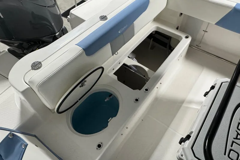 Slide: The Image of 2026 Robalo R202 Explorer boat interior with storage compartments and seating. - 11