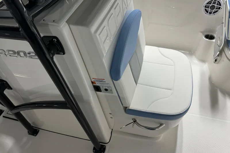 Slide: The Image of 2026 Robalo R202 Explorer boat seat with blue and white upholstery, featuring sleek design elements. - 5