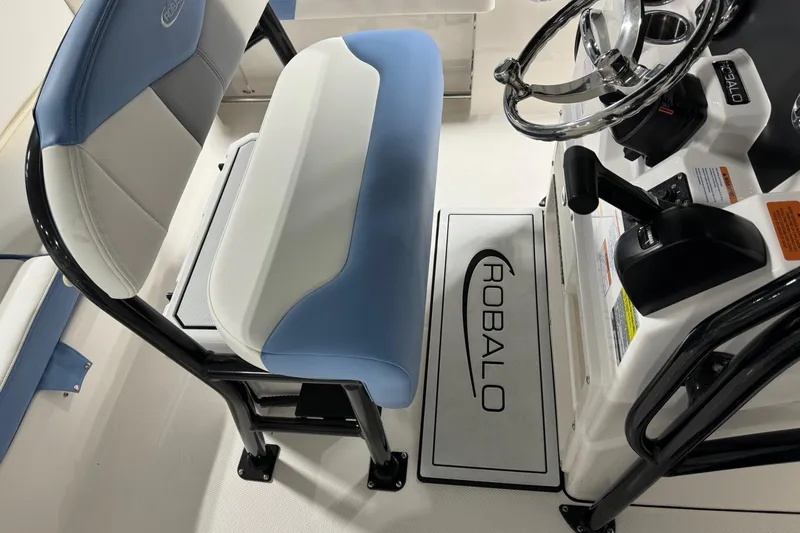 Slide: The Image of 2026 Robalo R202 Explorer boat interior with steering wheel and seating. - 8