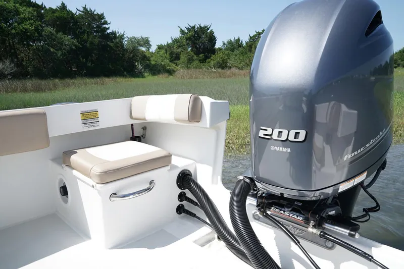 Slide: The Image of Storage compartment of 2018 Parker 2300 Special Edition boat with fishing gear and supplies. - 9