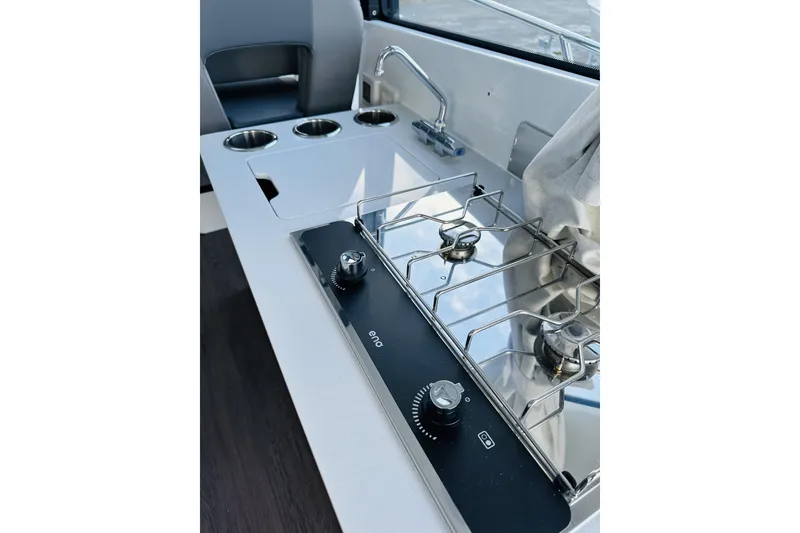 Slide: The Image of 2026 Beneteau Antares 9 V2 boat kitchen with stove and sink. - 14