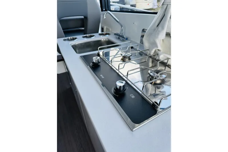 Slide: The Image of Modern kitchen area in 2026 Beneteau Antares 9 V2 boat with stove and sink. - 15