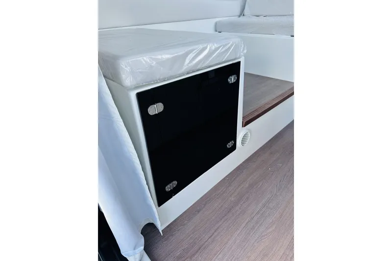 Slide: The Image of Interior view of 2026 Beneteau Antares 9 V2, featuring sleek cabinetry and modern design. - 16