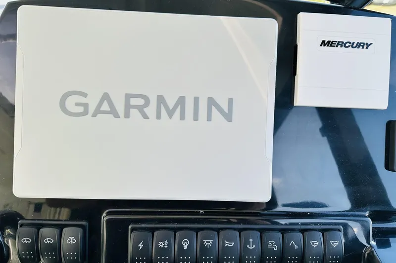 Slide: The Image of Garmin and Mercury controls on 2026 Beneteau Antares 9 V2 dashboard. - 26