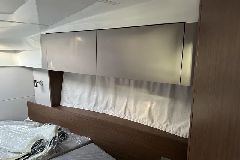 Slide: The Image of Interior of 2026 Beneteau Antares 9 V2, featuring sleek cabinetry and modern design elements. - 31