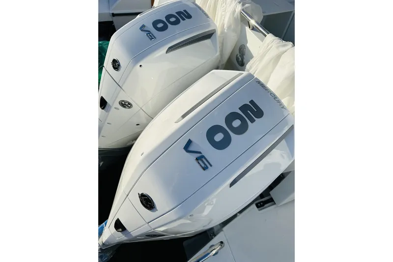 Slide: The Image of Twin Mercury outboard engines on a 2026 Beneteau Antares 9 V2 boat. - 4