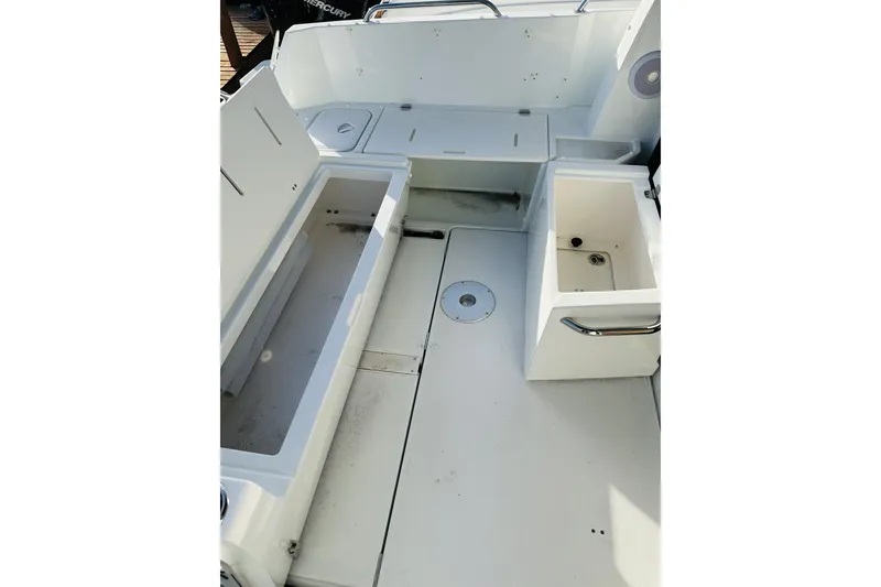 Slide: The Image of 2026 Beneteau Antares 9 V2 boat interior with storage compartments and seating area. - 7