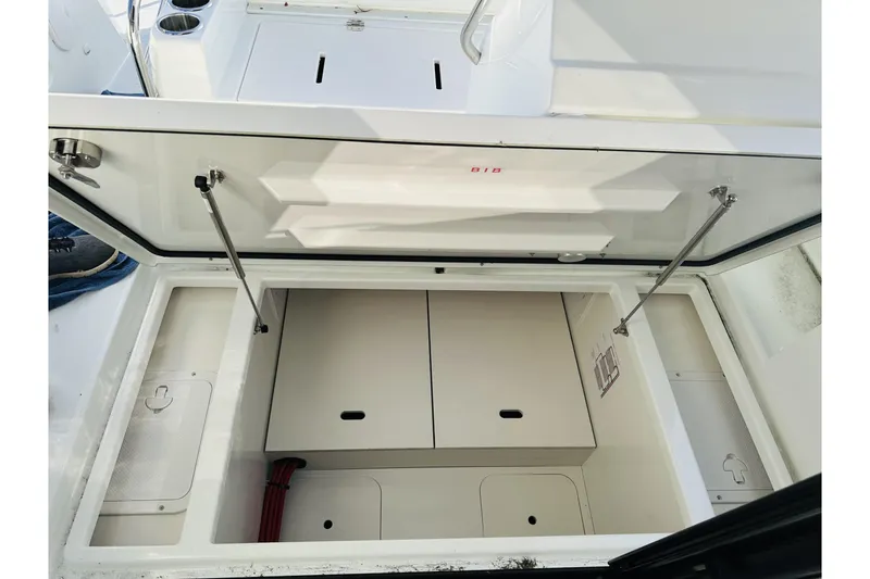 Slide: The Image of Open storage compartment on 2026 Beneteau Antares 9 V2 boat, showcasing interior space. - 8