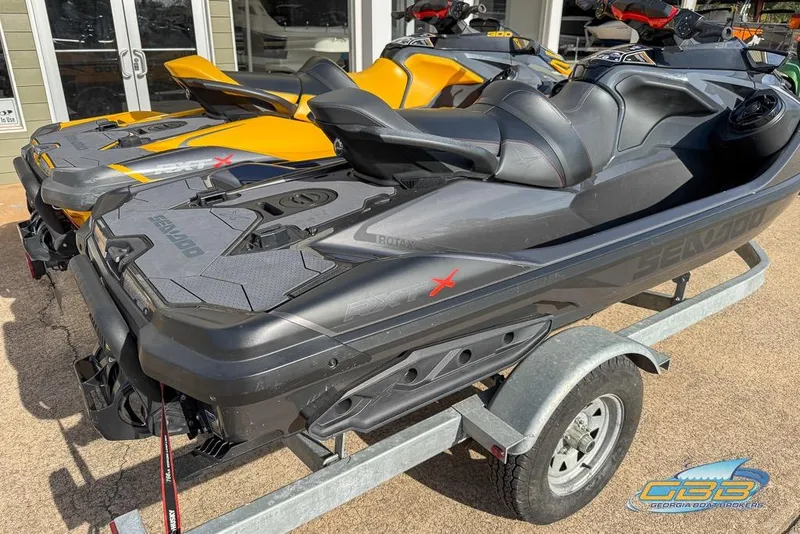 Slide: The Image of 2023 Sea-Doo RXT-X 300 jet skis on trailer, ready for adventure. - 11