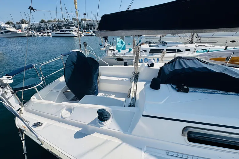 Slide: The Image of 1989 Hunter Legend 37 sailboat docked at marina with clear blue sky. - 10