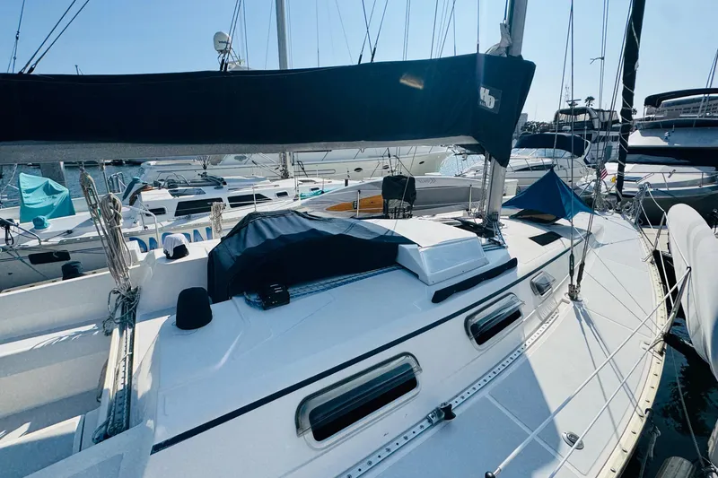 Slide: The Image of 1989 Hunter Legend 37 sailboat docked at marina with clear blue sky. - 11
