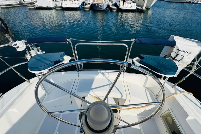 Slide: The Image of 1989 Hunter Legend 37 sailboat docked at marina, featuring sleek design and modern equipment. - 18