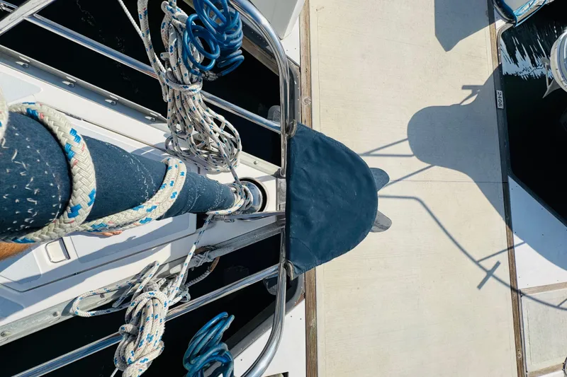 Slide: The Image of 1989 Hunter Legend 37 sailboat with open anchor locker, docked at marina. - 27