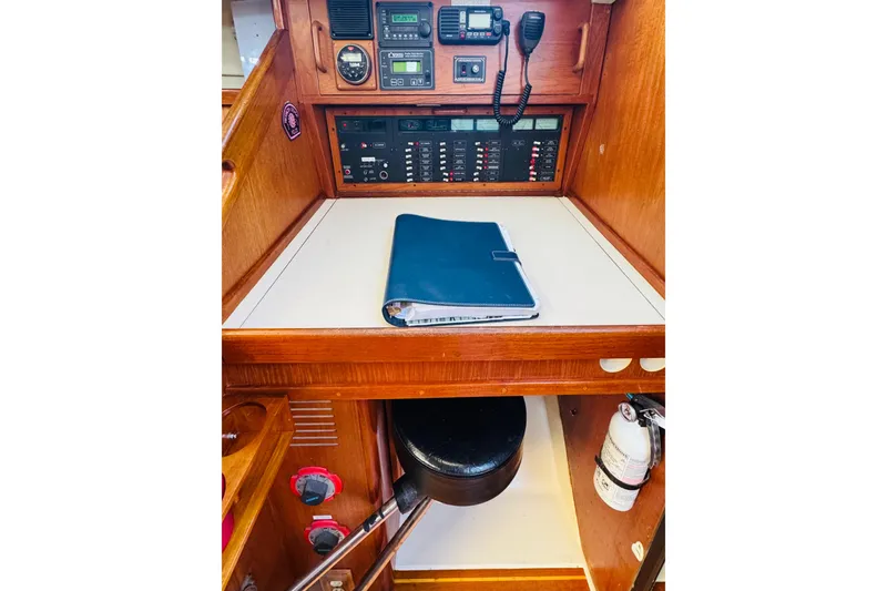 Slide: The Image of Interior of 1989 Hunter Legend 37 sailboat with cozy seating and wooden finishes. - 37